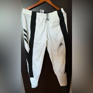 Adidas marathon pants with tags in size medium. Black and white